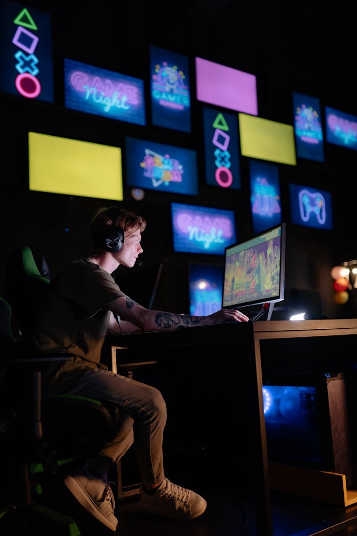 Service Young gamer engrossed in playing video games with a neon-lit background of multiple screens.